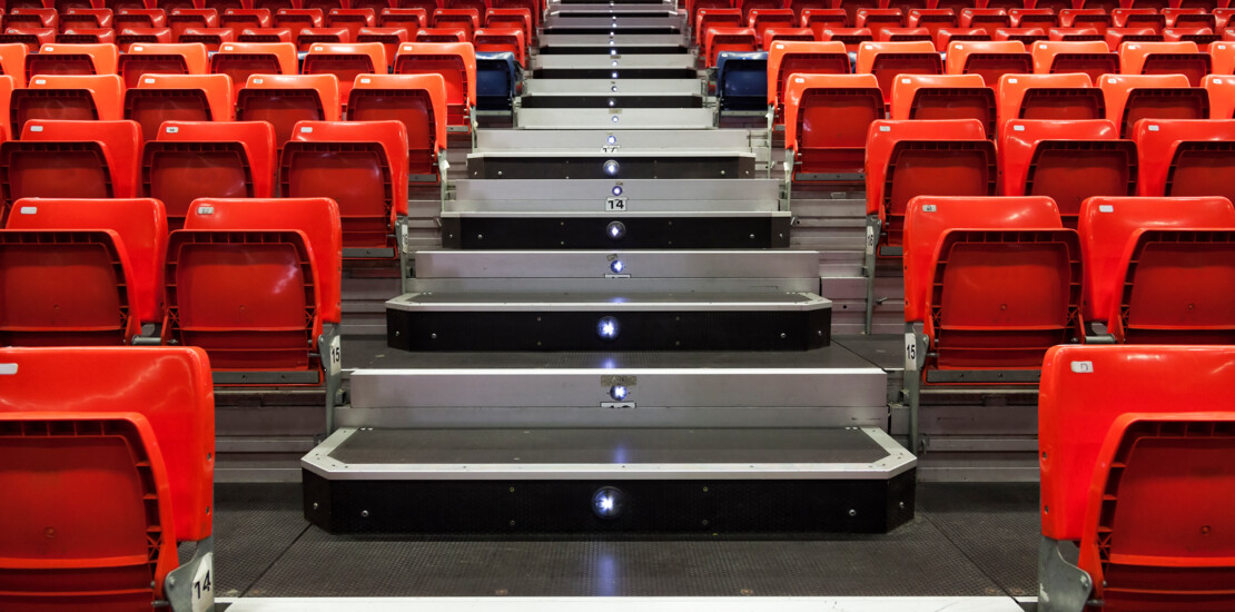 Grandstand seating with integrated steps using Comfodeck powered by alkus® panels for temporary event structures