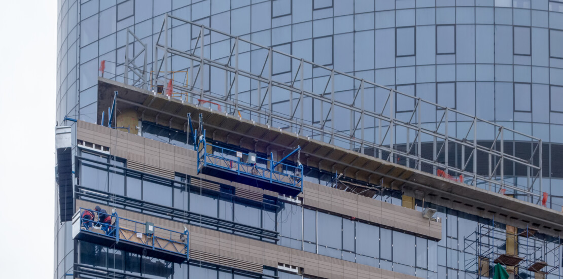 Special scaffolding application with cantilever platform and suspended access systems on a building facade using Comfodeck boards